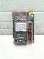 Front of retail-packaged Prostek A800 multitester with leads visible