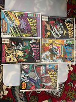 All five bagged Silver Surfer comics laid out