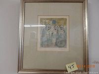 Framed artwork showing the full piece featuring three cloaked figures.