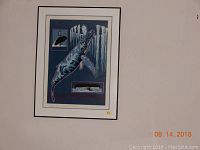 Framed print by Rich Hills titled Sons of Humpback 132/365, with visible small crack in the corner of the glass.