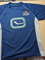 Blue Vancouver Canucks athletic shirt front view