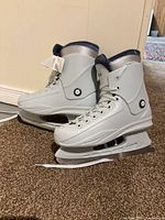 Side profile of both skates showing overall design, color, and blades
