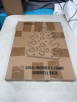 Front of sealed box showing product outline and branding