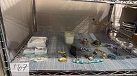 Overall view of jewellery lot on shelf
