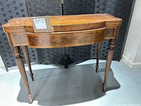 Full view of Baker Furniture side table, top closed