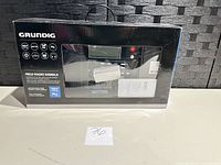 Front of sealed box showing Grundig S450DLX radio
