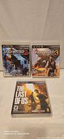 Front covers of all three PS3 game cases