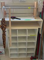 Front view of cubby organizer with rod rack on top