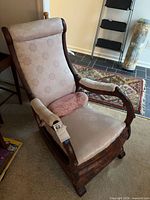 Overall view of rocking chair with pillow