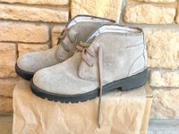 Side view of both boots on box