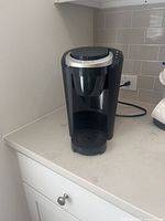 Front view of Keurig coffee maker on countertop
