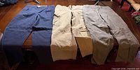 Three pairs of pants laid flat showing front view and colors