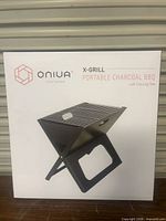Front of retail box showing Oniva X-Grill image and branding