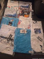 Group view of all sealed shirts displaying brands and packaging