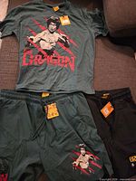 Overview of T-shirt and two pairs of shorts with tags visible