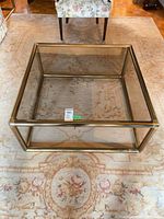top view showing square glass top and brass frame