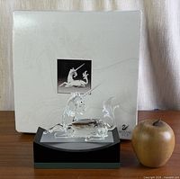 Full lot: unicorn on stand with box and apple for scale