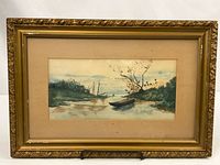 Front view of framed watercolor in ornate gold frame