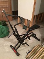 Full side view of Lifestyler Cardio Fit machine showing frame, seat, pedals, and handlebars in basement setting