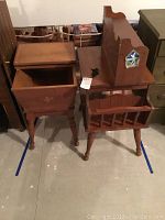 Both wooden magazine racks/tables and small wood shelf shown together, displaying condition and overall style