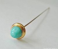 Hatpin head showing cabochon and gold bezel