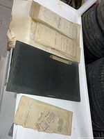 Overview showing ledger, three folded deeds and loose documents