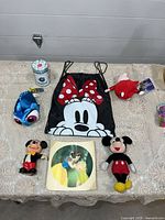 Group shot showing all Disney items in lot