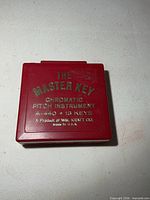 Closed red case showing brand, model and specs