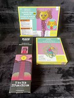 Front view of all three boxed kits showing branding and product images