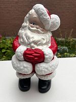Front view of ceramic Santa showing color, pose and condition