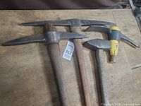 Three pick-style tools on bench