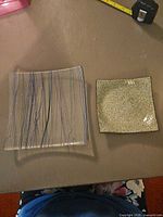 Both square plates side by side for size comparison
