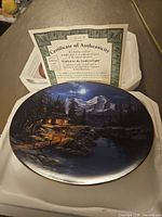 Front of porcelain plate with certificate in box