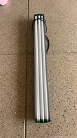 Full view of 4-tube fluorescent fixture showing length and attached cord
