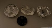 Group shot: round swirl paperweight, heart-shaped paperweight, faceted figure, black suction stand