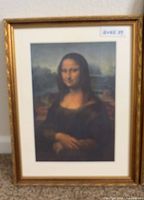 Full view of framed Mona Lisa reproduction standing against wall