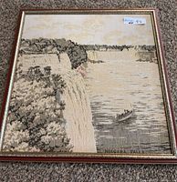 Full view of framed woven Niagara Falls tapestry