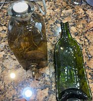Dispenser next to flattened bottle tray on countertop