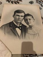 Charcoal/graphite couple portrait with damage at lower left