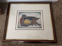 Full view of framed print showing frame, mat and glazing
