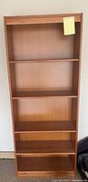 Full front view of bookcase with five shelves