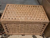 Closed wicker chest showing top weave and overall shape