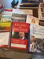 Group of nine books laid out showing titles