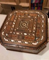Top view showing marquetry pattern and mother-of-pearl inlay