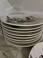 Stack of cartoon illustrated ceramic plates