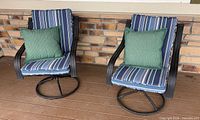 Front view of both chairs showing cushions and pillows