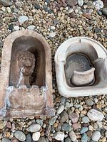 Both fountain pieces resting on gravel showing overall form and color