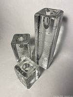 Front view of three clear glass Arkipelago candle holders showing relative sizes