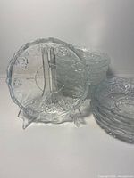 Stack of clear crystal bowls with one displayed upright
