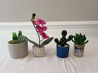 Group shot of all four mini artificial potted plants